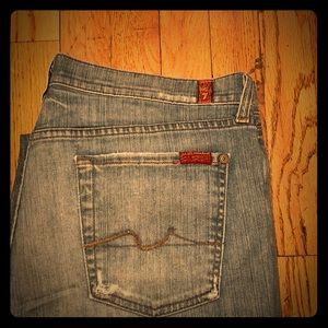 Distressed button guy relaxed fit 7 jeans